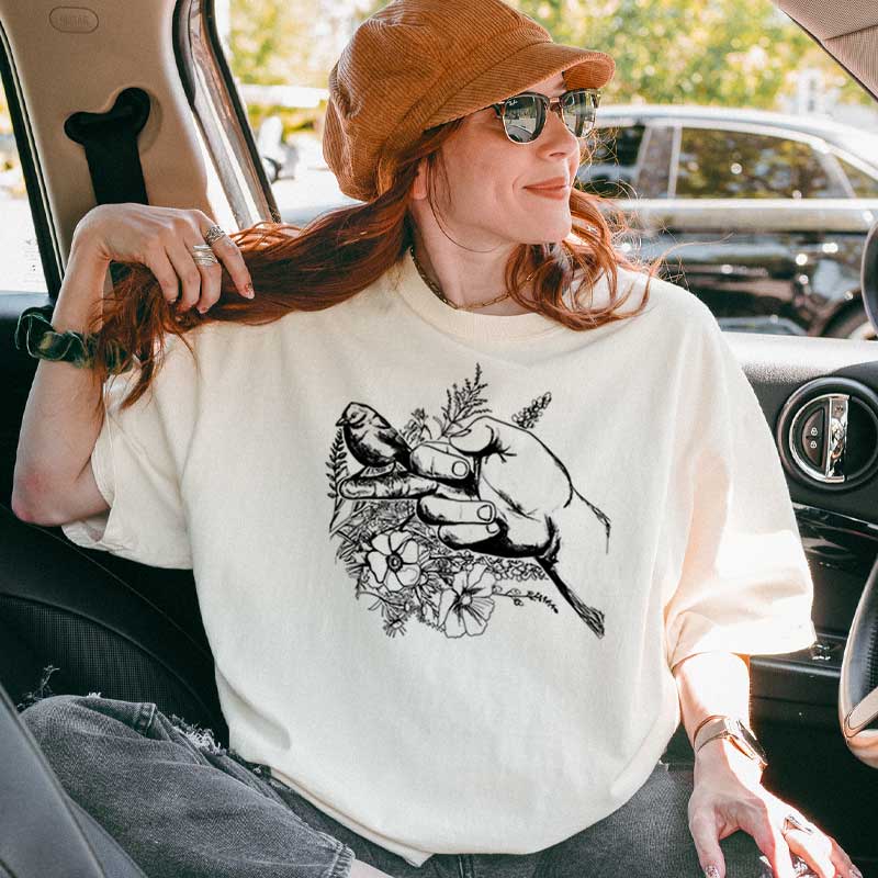 The Bird T-shirt featuring bird and flower background